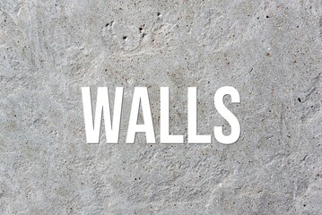 WALLS - word on concrete background. Cement floor, wall.