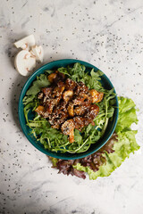 warm salad with mushrooms and arugula top view