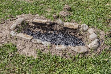 Remains of a campfire after a picnic in nature