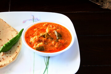  indian gujarati traditional dish food chapati or roti serve with mix vegetable masala curry