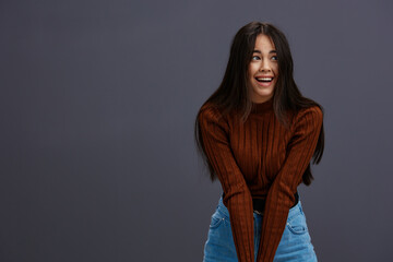 Brunette brown sweater glamor posing smile fashion studio model