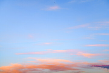 Orange clouds on blue sky in morning 
