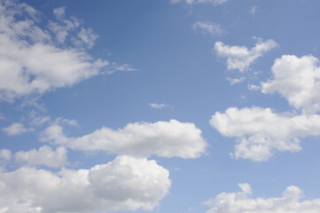 Scenic view of blue sky with white cumulus clouds, natural background