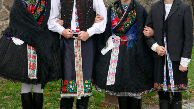 Traditional folk costumes worn by young people in Holloko village in Hungary, an UNESCO World Heritage site 