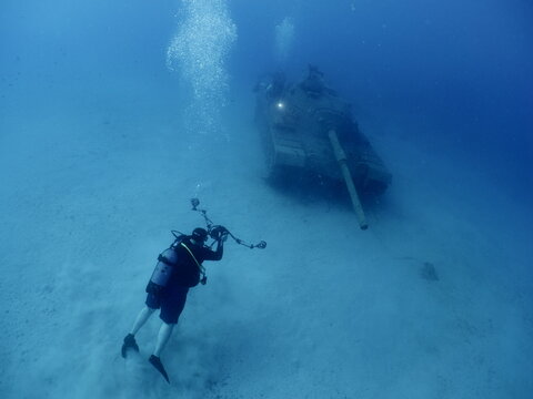 scuba diver exploring tank wreck underwater wreck dive blue water kas turkey