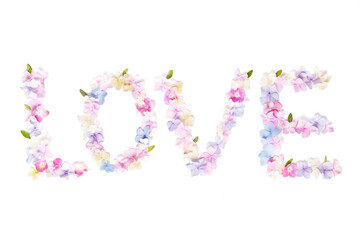 The word love made from hydrangea flowers on a white background isolated. Flower letters