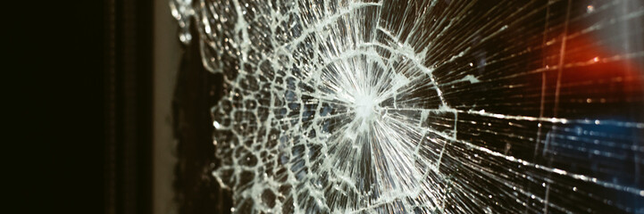 broken glass against the background of the night city and night lights. Web banner.
