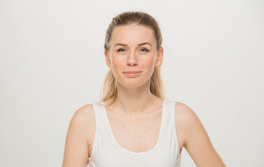 Fototapeta premium Portrait of a beautiful young women, dressed white T-shirt , isolated on white.emotional portrait of a young Ukrainian girl