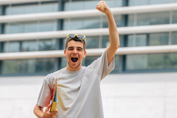 euphoric student celebrating the passed exam or going back to school