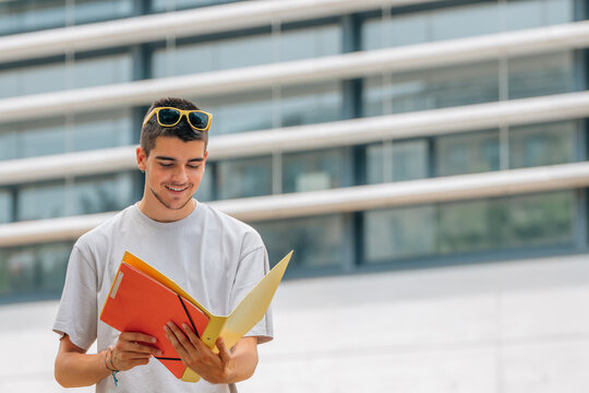 student with books on the street back to school