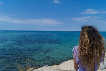 girl watching the blue sea