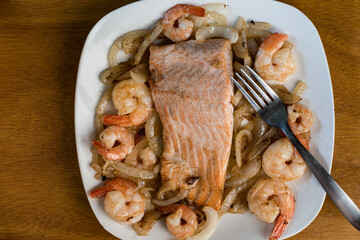 baked salmon  with sauteed onions and shrimp
