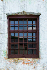 vintage window in an old farmhouse or barn, wall painted with white paint