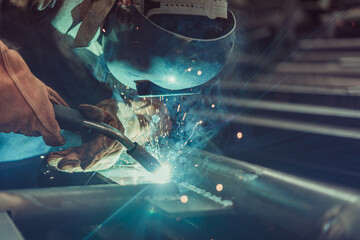 INDUSTRIAL WORKER SOLDERING