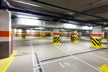 empty underground parking lot with bright markings in a stylish office building