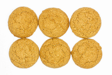 Oatmeal cookies on white background. Isolated. Oatmeal Raisin Cookies made from an oatmeal-based dough whose ingredients include flour, sugar, eggs, salt and spices. Dessert, snack. Close-up. Top view
