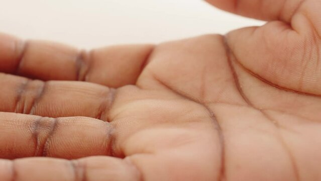 Black skin texture close-up, hand palm close-up. Native African American woman, arm surface macro shooting. Body and healthcare, hygiene and medicine concept.