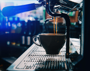 espresso machine pouring espresso into cup