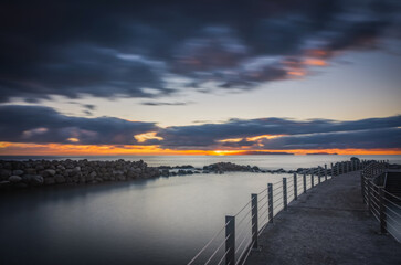 Obraz premium Sunrise on Reis Magos beach. Canico, Madeira, Portugal. October 2021. Long exposure picture
