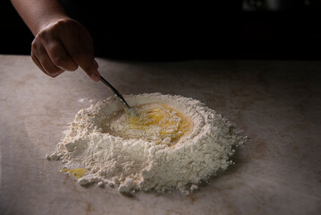 Mixing flour and egg 