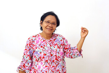 Portrait of asian elderly woman standing while holding something. Isolated on white background