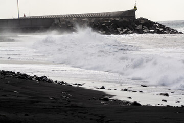 Waves in stormy winter day on black sandy beach in Tazocorte, La Palma island, Canary islands, Spain