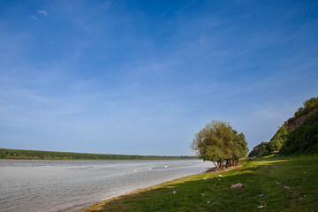 Panorama of the Danube river in Surduk, Vojvodina, Serbia, during a sunny afternoon, facing a green...