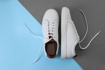Pair of stylish sports shoes on color background, flat lay