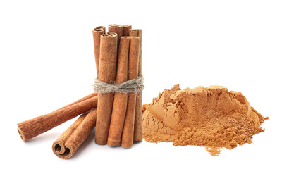 Aromatic cinnamon sticks and powder on white background