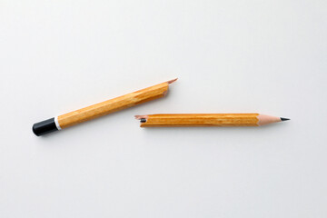 Broken pencil on white background, flat lay