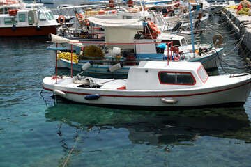 Beautiful view of coastal city with different boats on sunny day