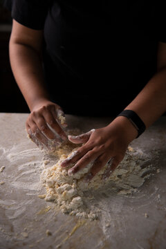 Woman kneading dough 