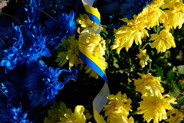 Blue and yellow stripes with colored flowers Ukraine flag, the war in Ukraine concept