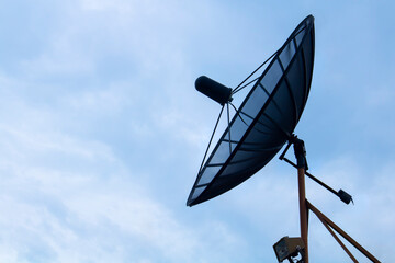 large Satellite Dish on blue shy day