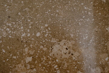 A natural stone. Pale biege marble. Background. Texture. Close-up.