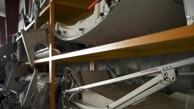 Aircrafts spare parts stored on shelves in the warehouse. Close-up shot