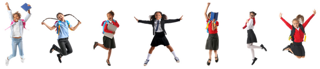 Collage of jumping little school girls on white background