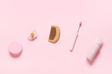 Bath accessories for baby girl on pink background