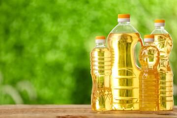 Bottles of sunflower oil on table outdoors
