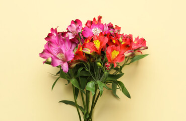 Bouquet of beautiful alstroemeria flowers on color background