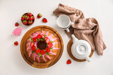 Composition with tasty strawberry cake, sauce and teapot on light background