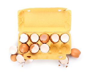 Cardboard holder with broken egg shells isolated on white background