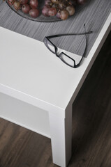Eyeglasses on wooden desk