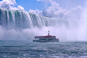 Niagara Falls tour boat is shrouded in mist as it approaches the Horseshoe Falls