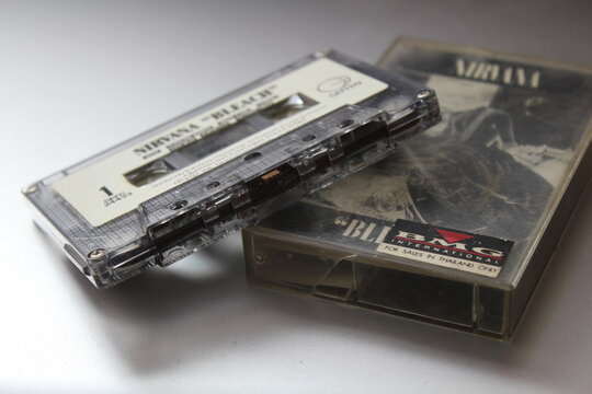 Bangkok, Thailand - 09 February 2022 : 90's cassette tape of Nirvana Bleach album on gray background.