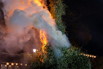 Fototapeta na wymiar Burning Bamboo Pyre at Hachiman Matsuri, Smoke Filling the Air