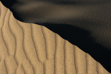Light and Shadows on Patterns of Sand Dunes