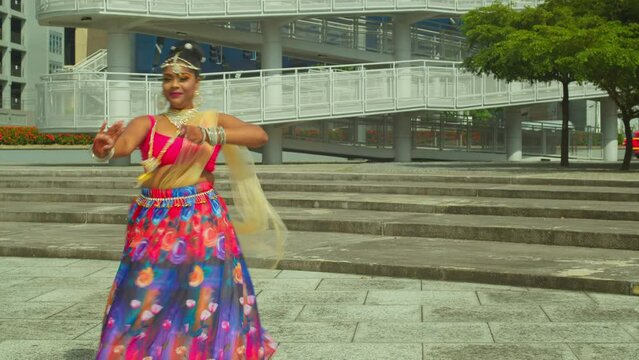 Epic dance tutorial performed by an East Indian woman in Traditional Indian wear