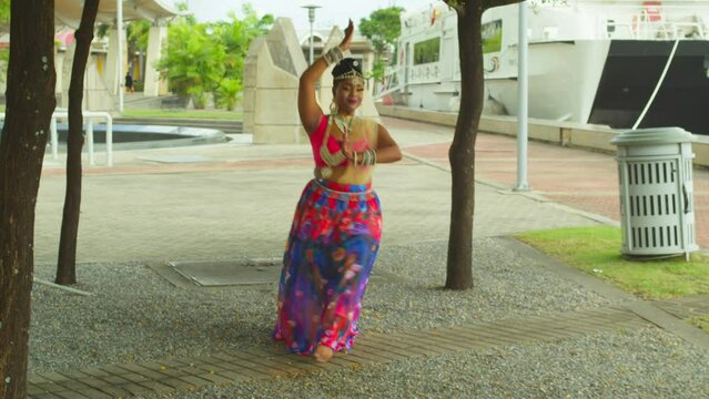 Taditional dance performed by an east indian girl in the amazing Caribbean city of Port of Spain, Trinidad
