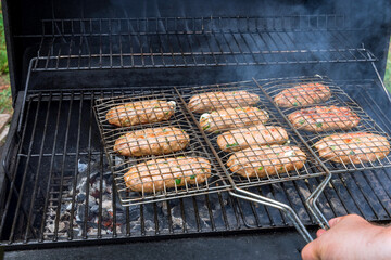 Served on a hot BBQ grill with American barbecue foods including burgers beef roasts